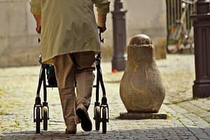 man walking with a walking aid