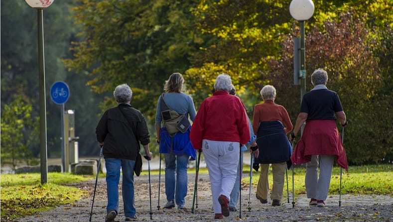 women walking with aids 